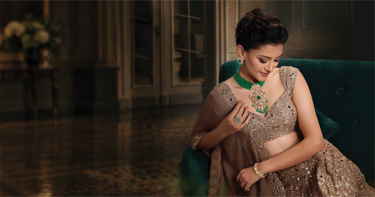 Bride wearing emerald and diamond bridal jewellery
